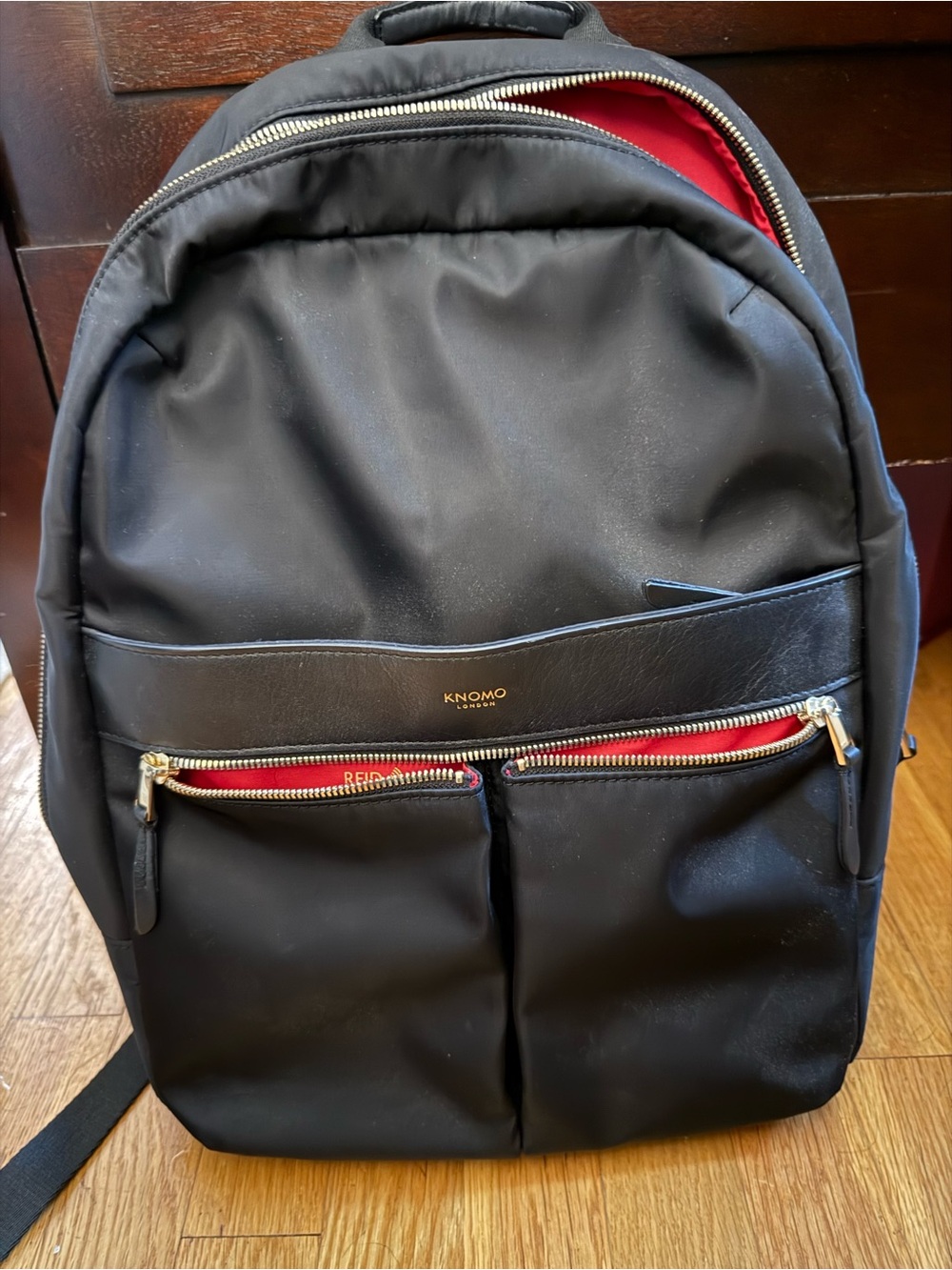 KNOMO Black Backpack with Red Interior and Gold Hardware